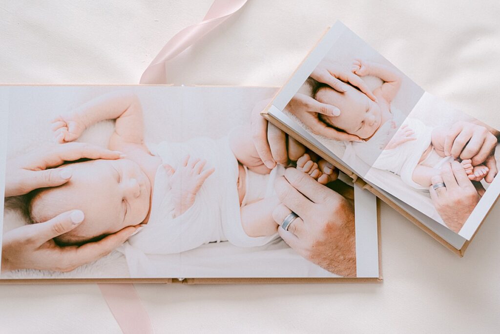 Heirloom Album spread of newborn photo and matching mini duplicate album designed by scottsdale az photographer