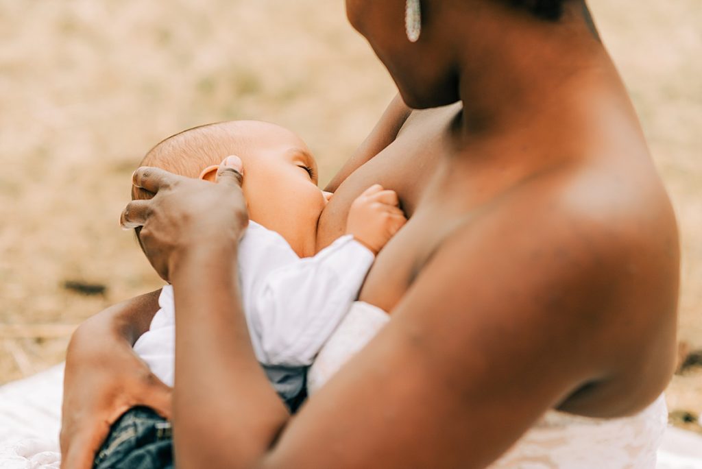 mom holding baby while breastfeeding
