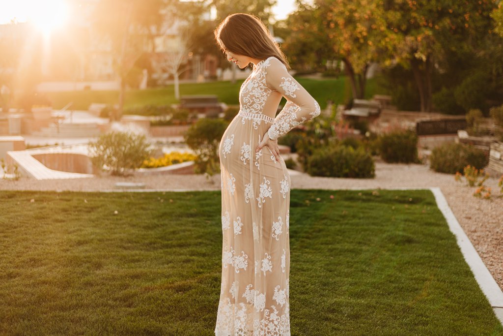 pregnant woman in lace gown in scottsdale civic center park