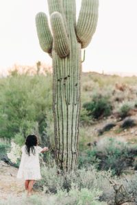 toddler girl by saguaro cactus