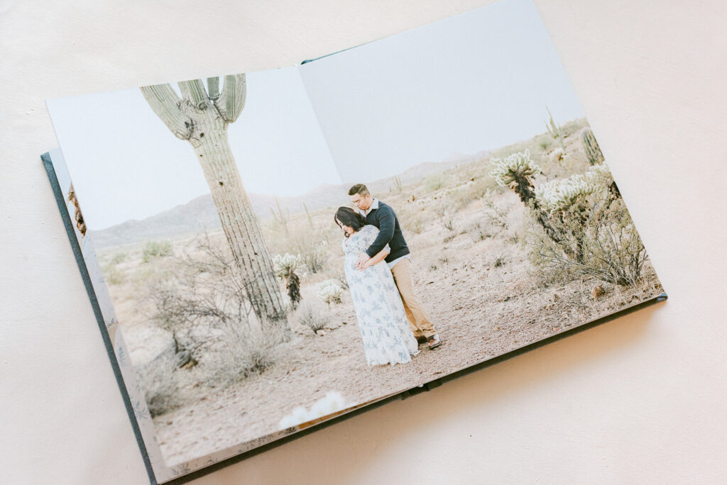heirloom album spread of expecting couple in apache wash- a beautiful desert maternity photoshoot location