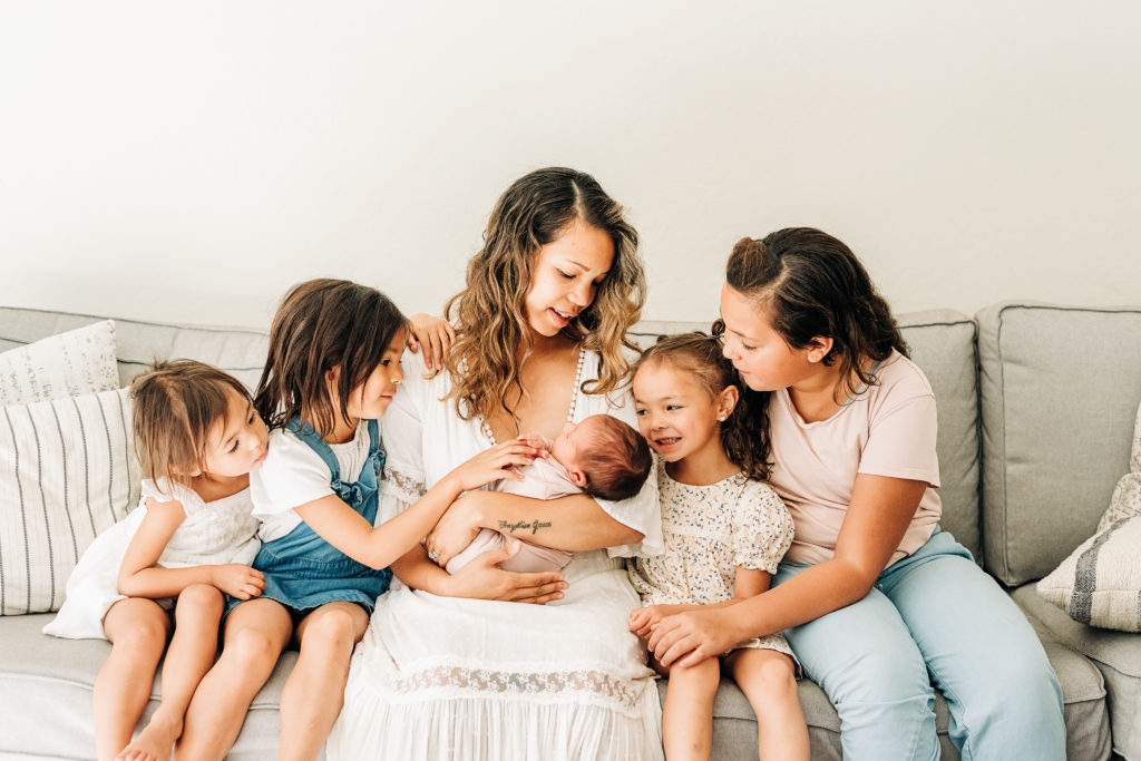 Mesa Newborn photographer captures Mother with five daughters for in-home newborn photos.