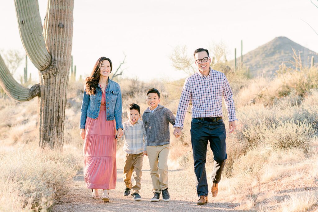 Phoenix Family of four walking on brown's ranch trailhead hiking trail.