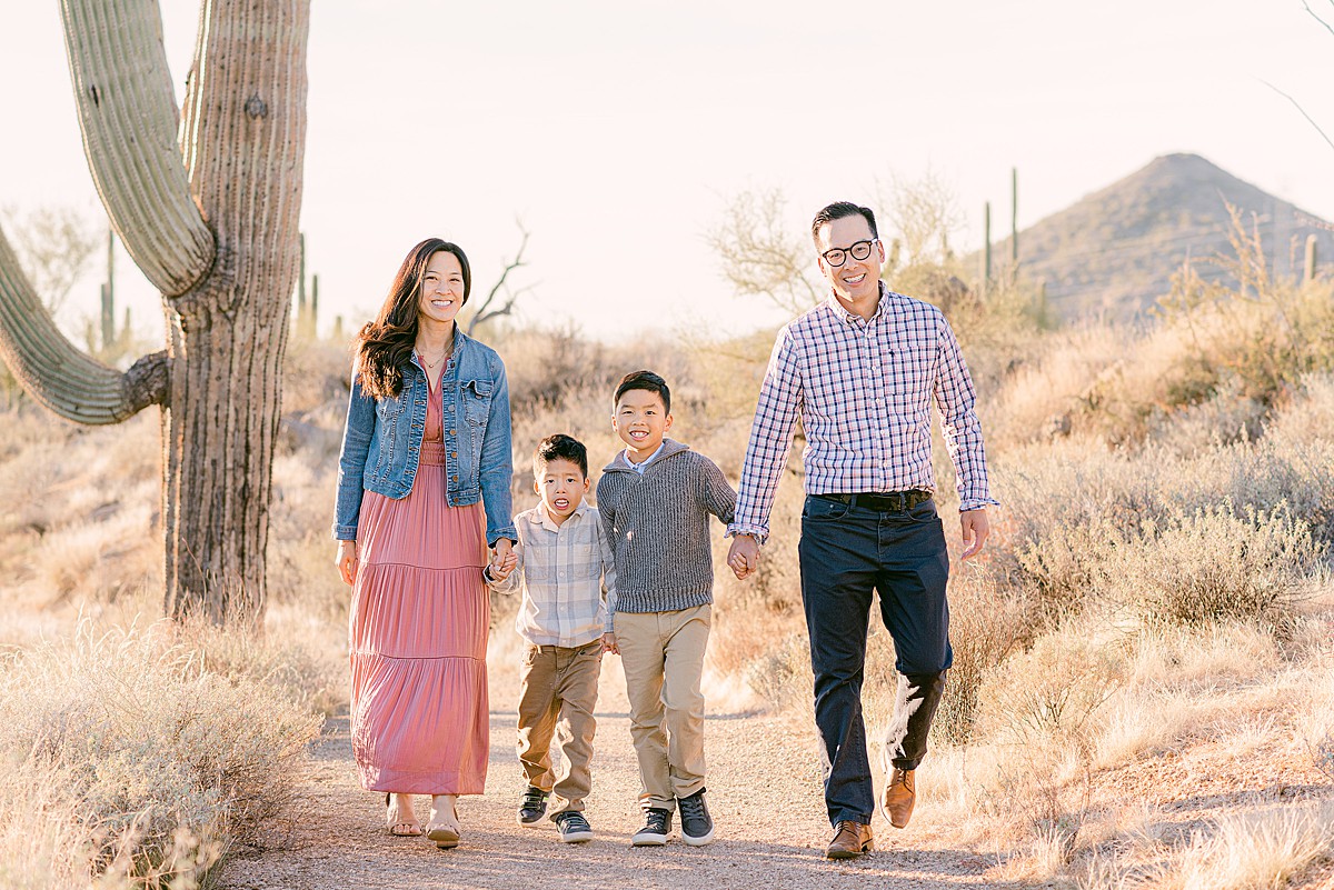 Family of four with two young boys walk Scottsdale trail- part of things to do in Phoenix