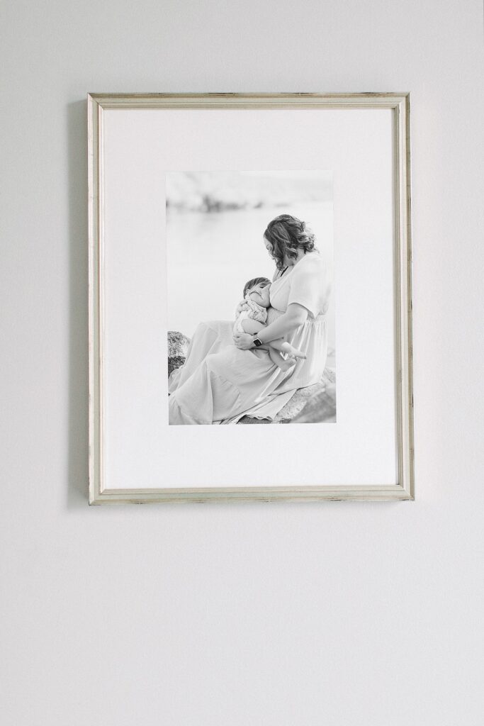 Fine art print of photo to the left of mom breastfeeding baby in a silver frame for mother's day ideas.