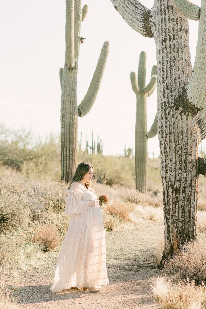 Expecting mom in flowy cream chiffon dress styled for fall family photos