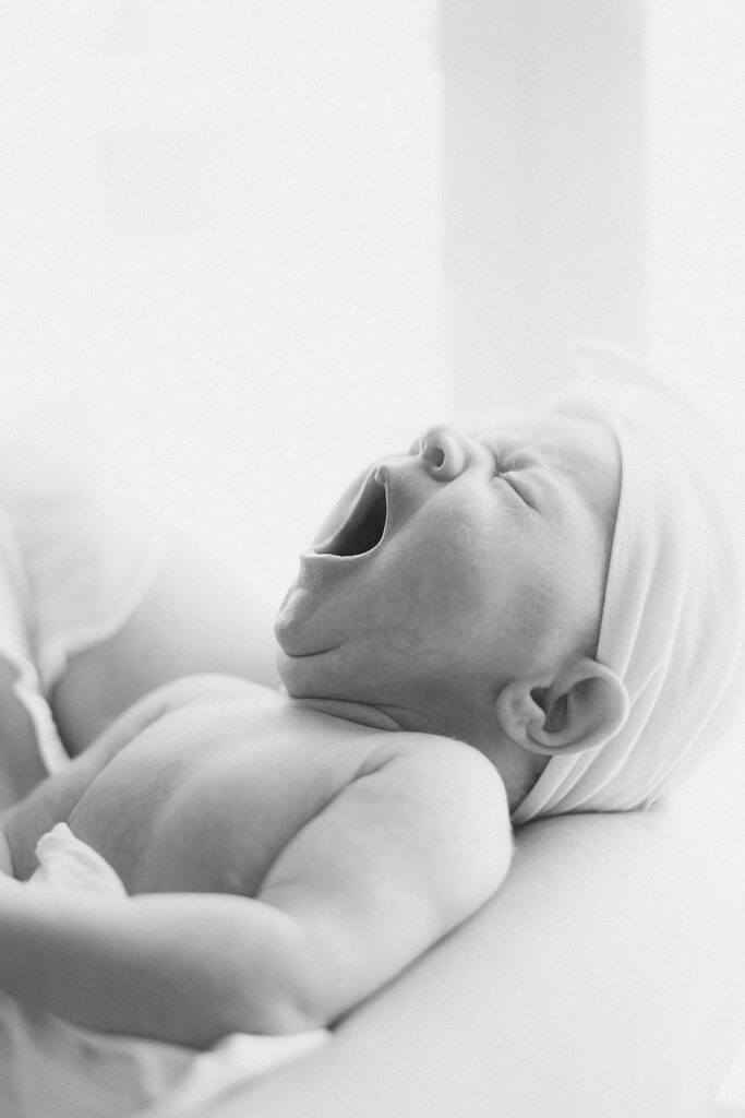 closeup of newborn baby yawning