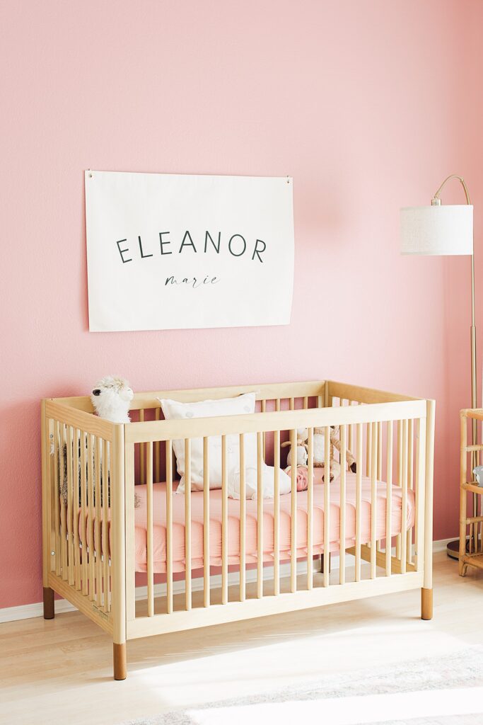 queen creek photographer captures newborn baby girl nursery featuring blush pink and bamboo crib