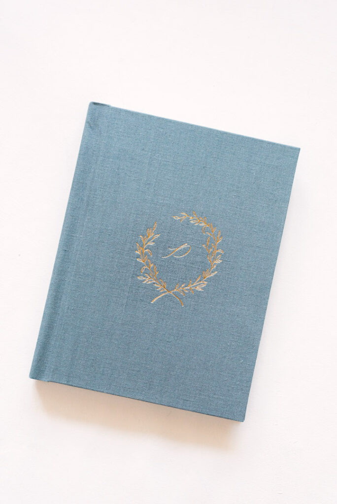 cover of linen heirloom album with gold debossing