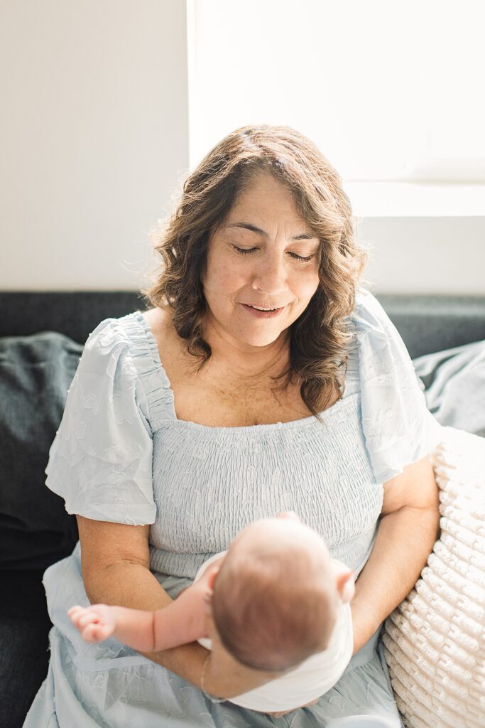 grandmother face to face looking at baby