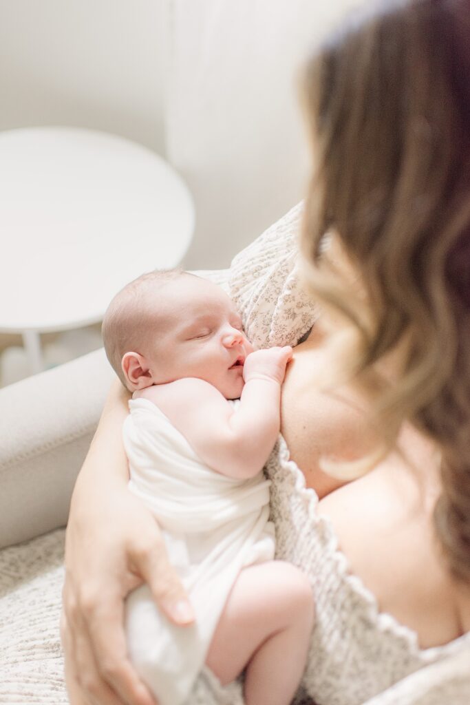baby boy snuggled and sleeping at mom's chest for newborn photographhy Gilbert, AZ