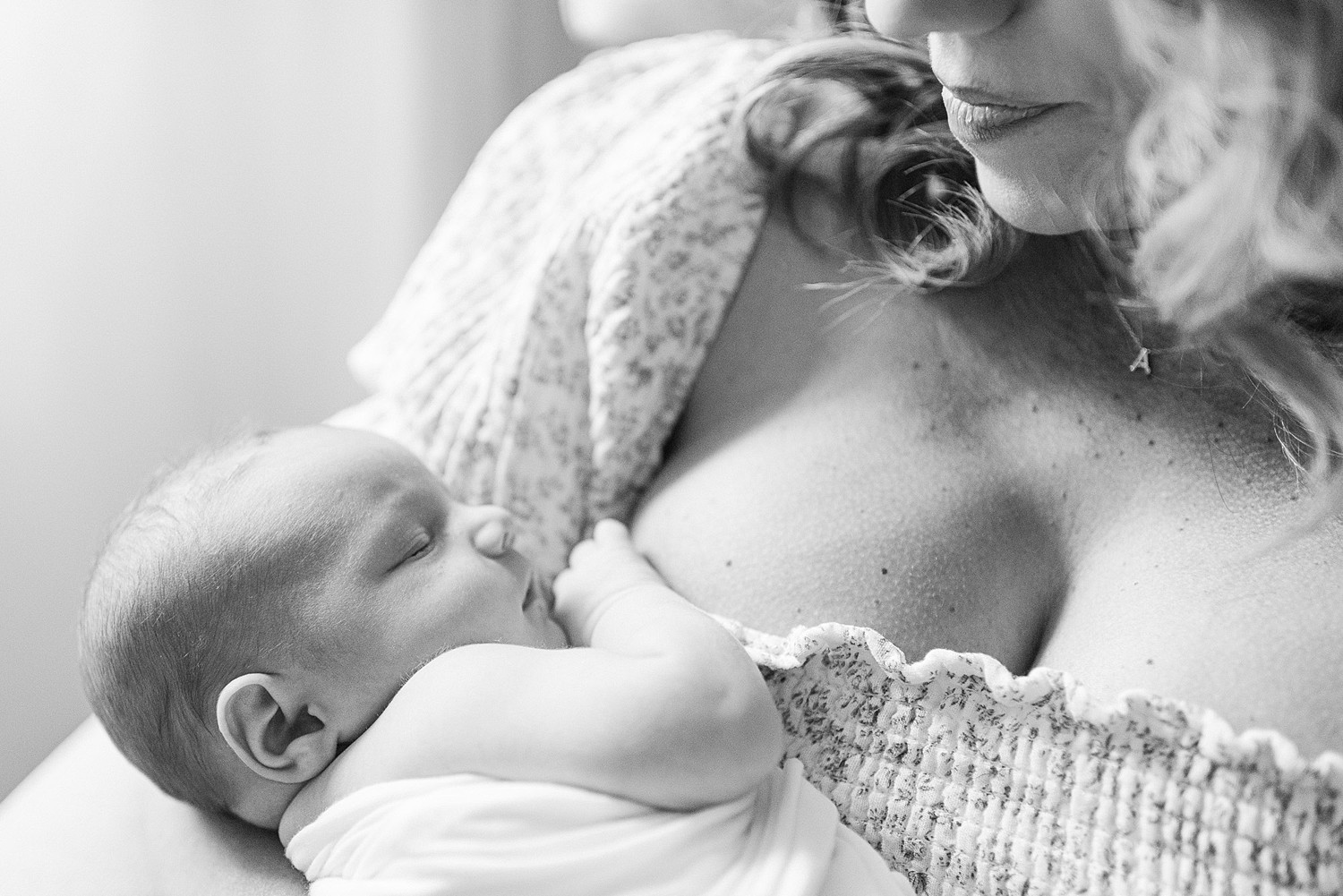 Closeup of new mom holding baby for newborn photography in Gilbert AZ