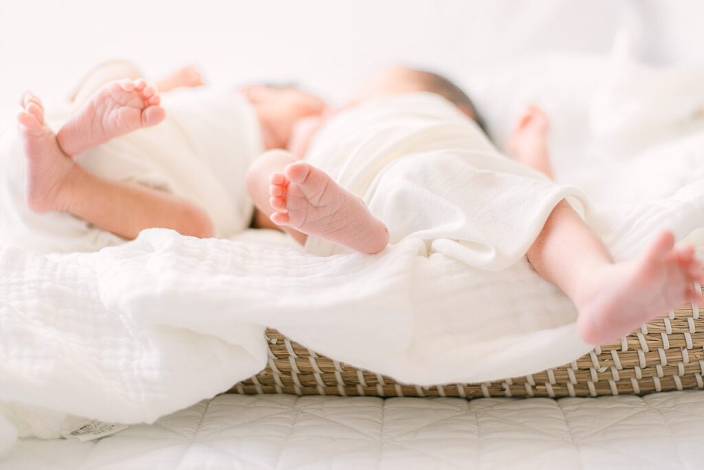 Feet of twin newborn boys for lifestyle newborn photos